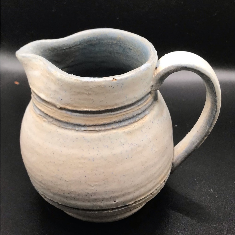 Artisan blue/white pottery pitcher. READ